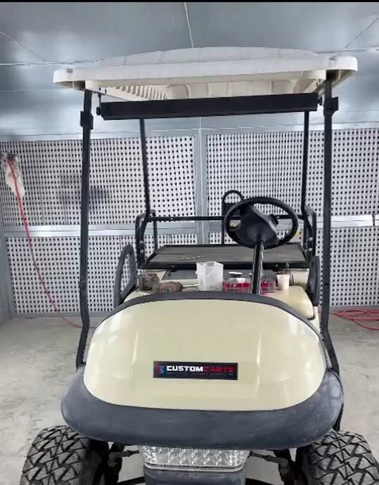 Custom cart body in cream fibreglass inside the workshop